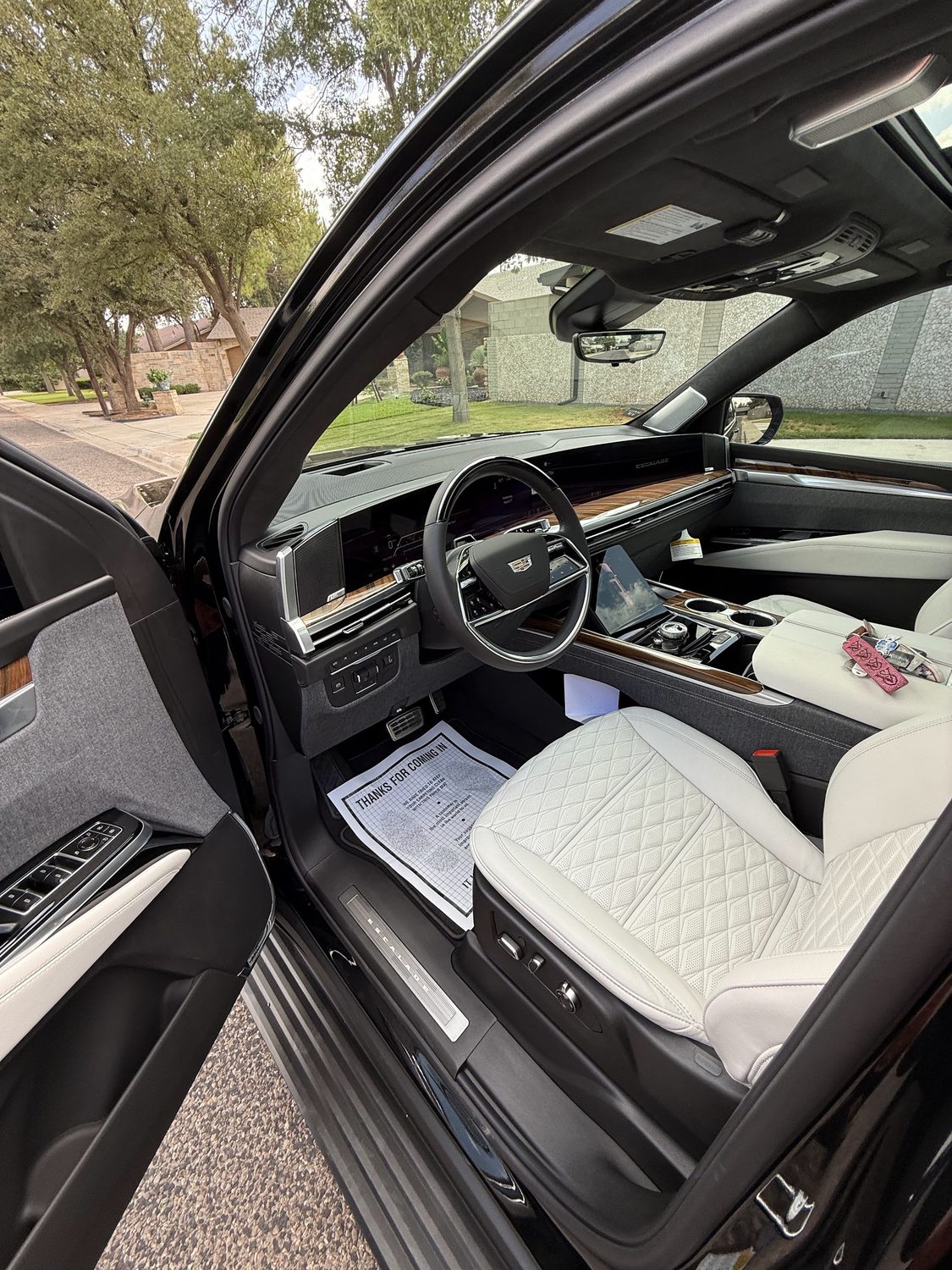 White quilted leather interior of a Cadillac Escalade detailed by AutoX